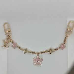 Luxury Murakami Bag Chain with Pink and gold floral charms.